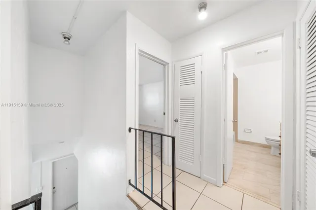 a bathroom with a sink a toilet a mirror and vanity