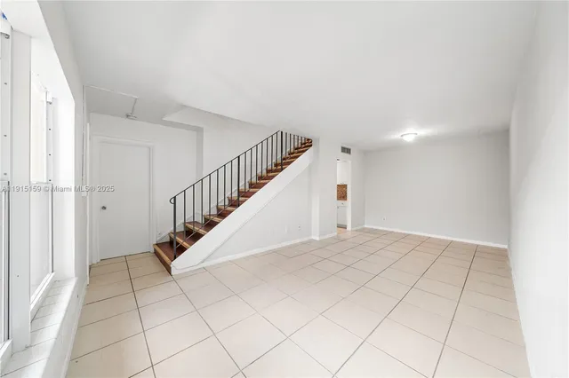 a view of entryway and hall with a window