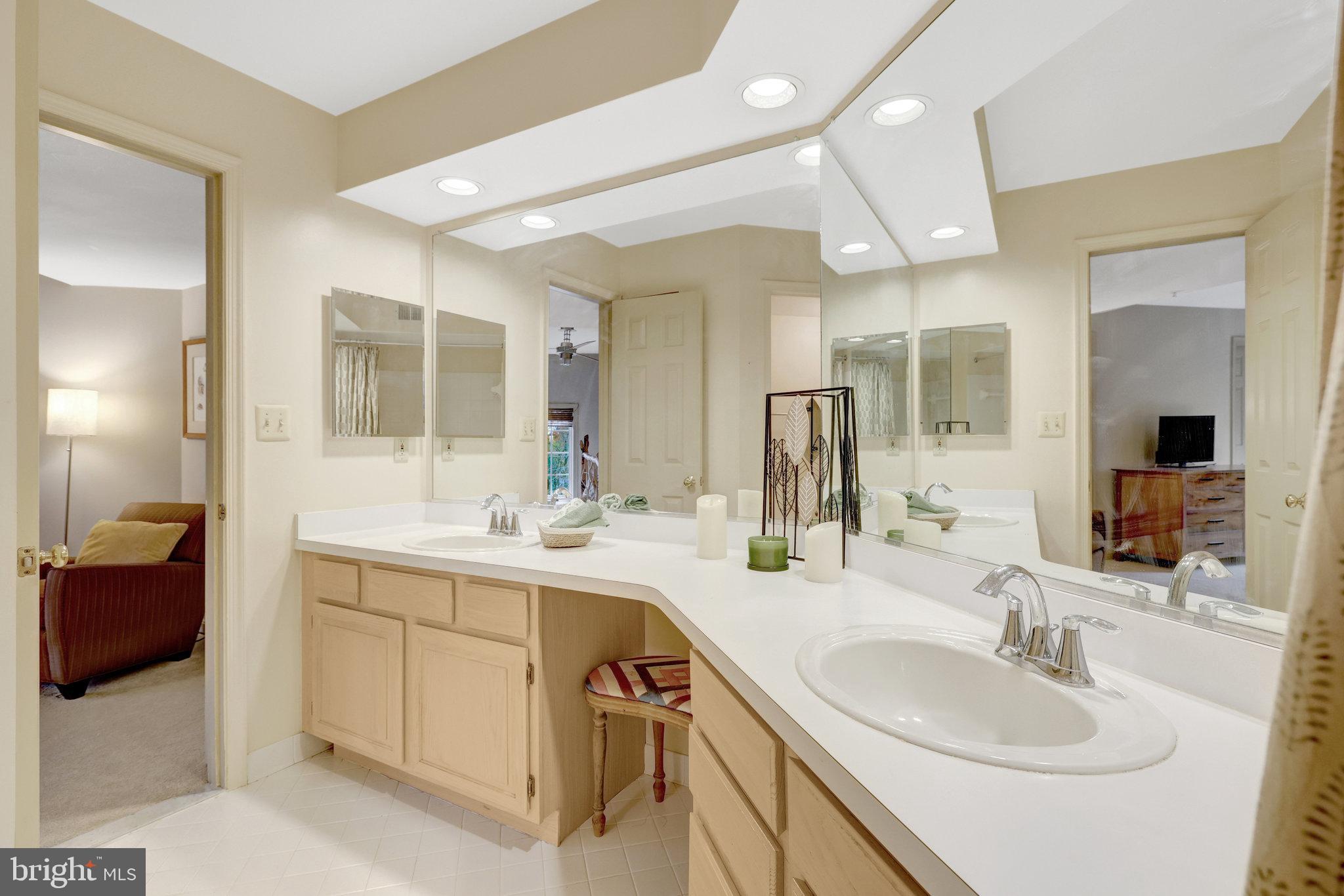 1334 Garden Wall Circle, Unit E Reston, VA 20194 - Photo 12 of 23 a bathroom with a sink double vanity and a mirror