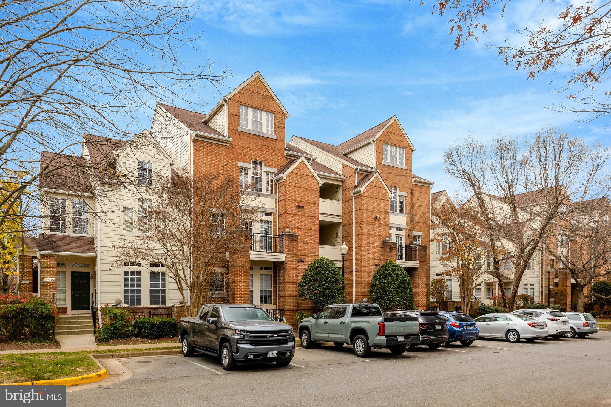 1334 Garden Wall Circle, Unit E Reston, VA 20194 - Photo 13 of 23 a car parked in front of a building