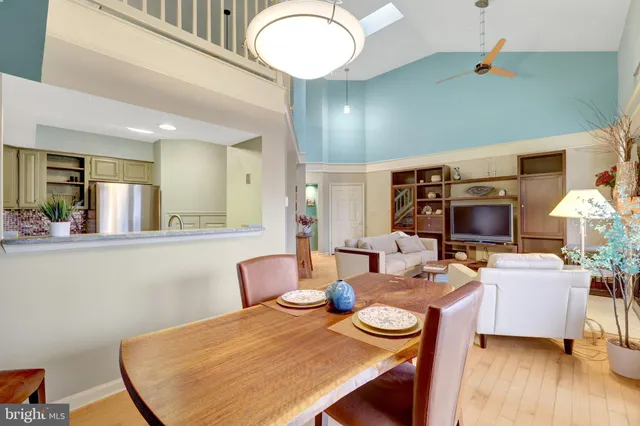 a living room with fireplace furniture and a wooden floor