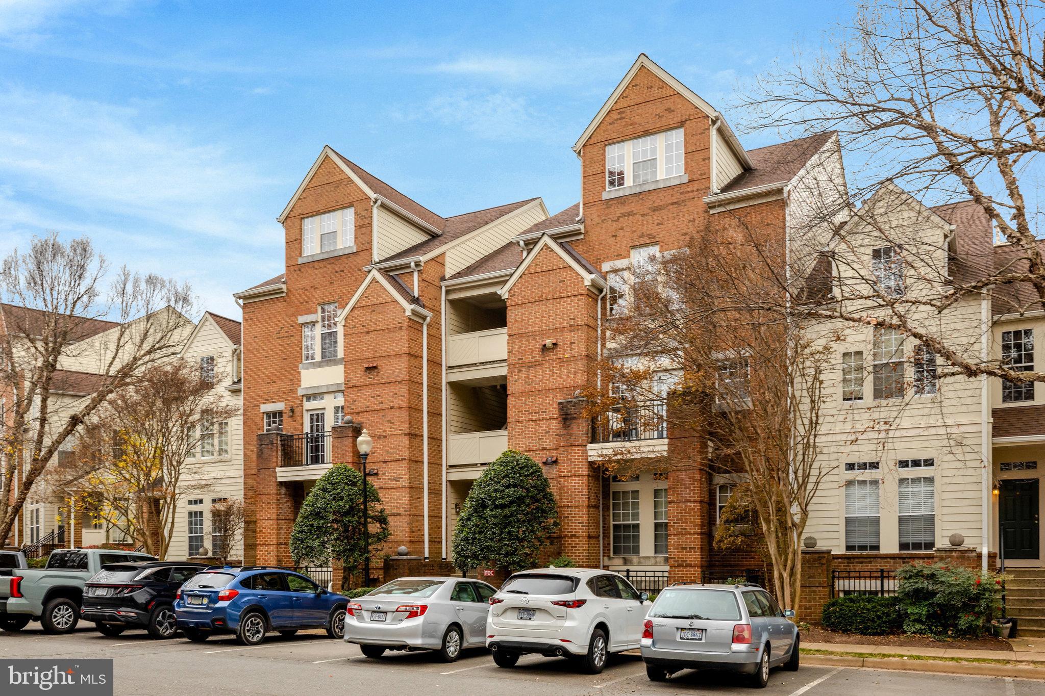 1334 Garden Wall Circle, Unit E Reston, VA 20194 - Photo 17 of 23 a car parked in front of a building