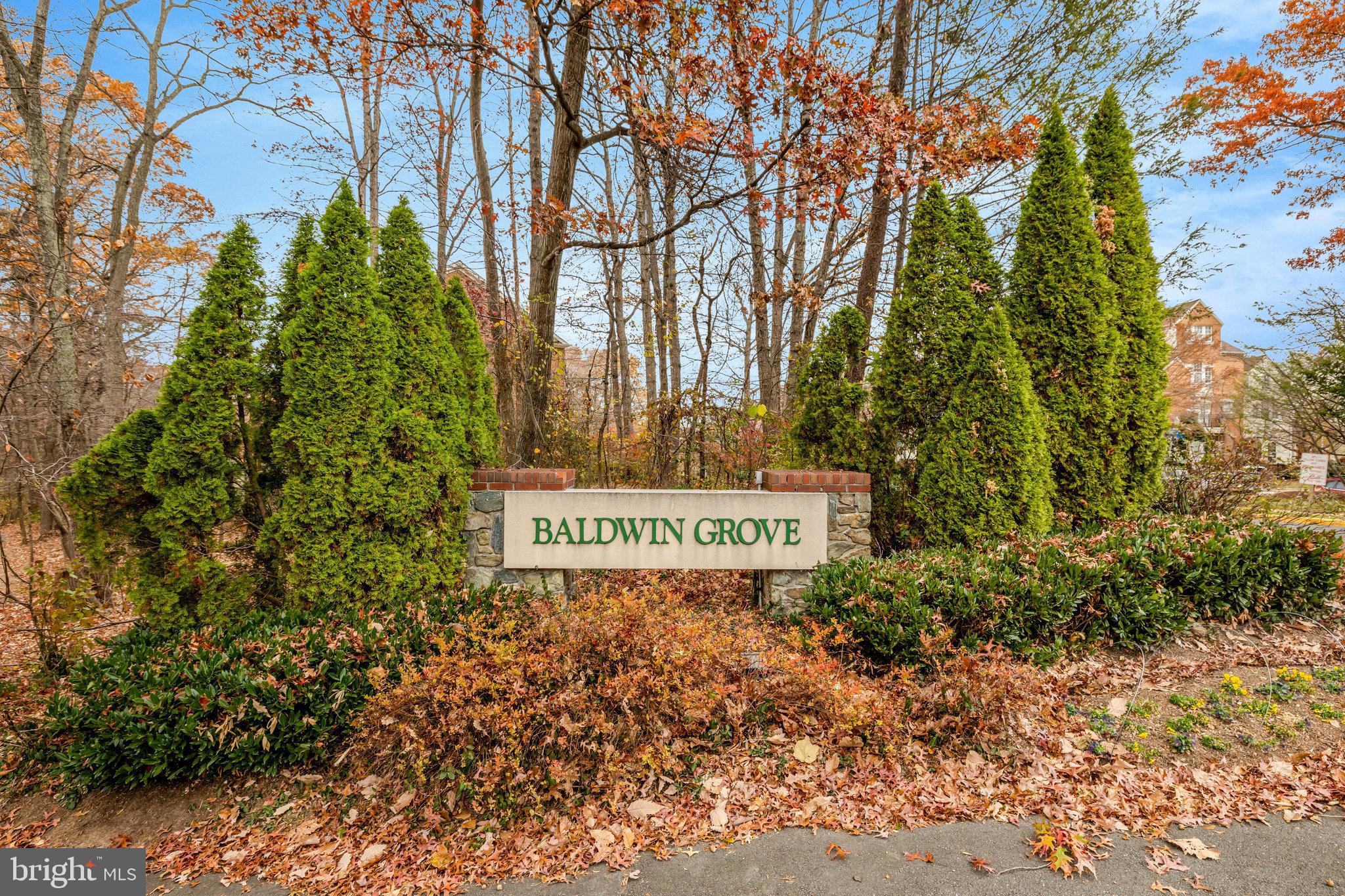 1334 Garden Wall Circle, Unit E Reston, VA 20194 - Photo 18 of 23 a sign on the side of the road