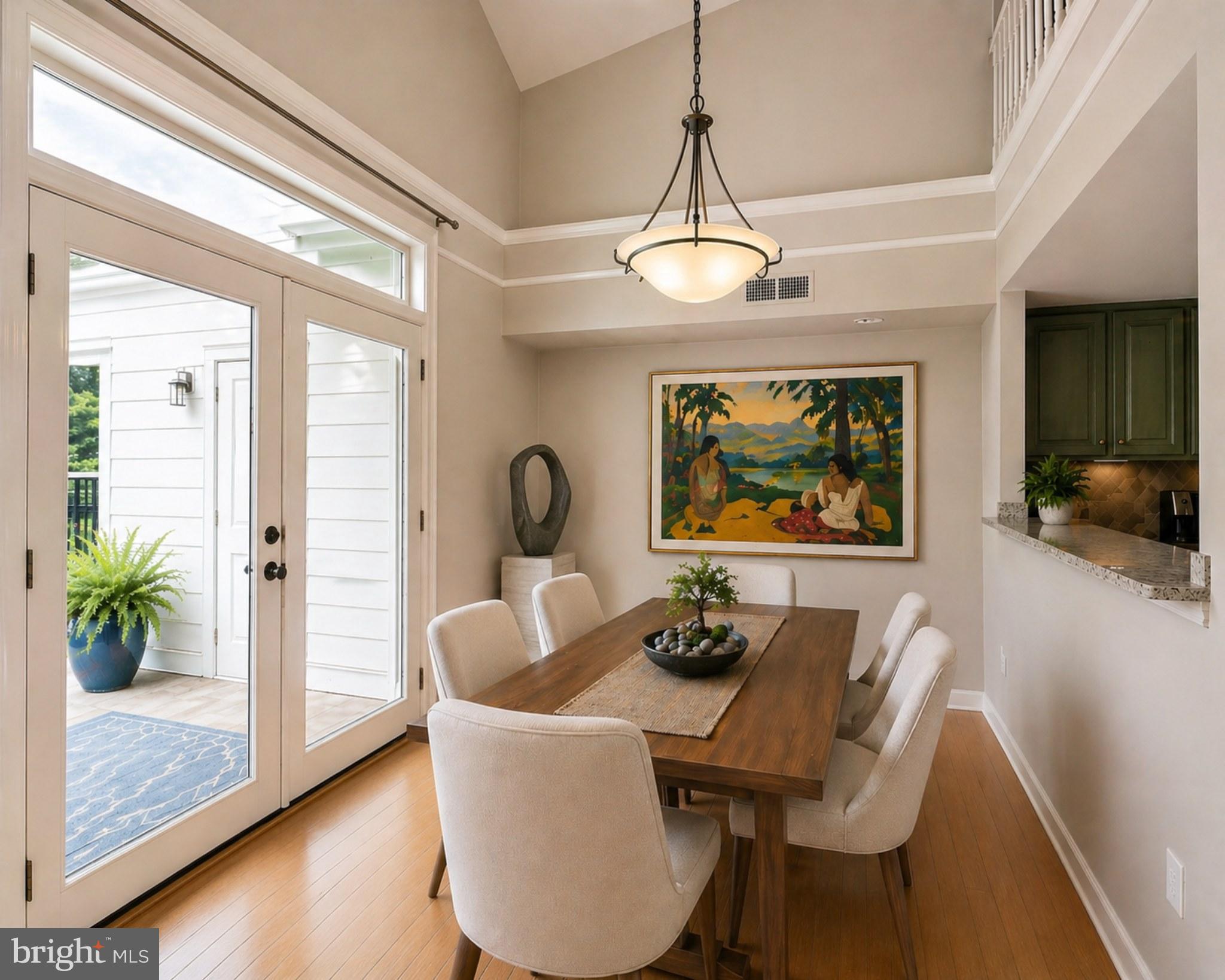 1334 Garden Wall Circle, Unit E Reston, VA 20194 - Photo 2 of 23 a dining room with furniture a chandelier and wooden floor