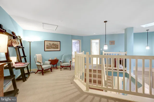 a view of a livingroom with furniture and windows