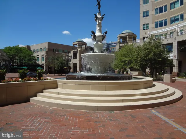 a view of fountain in front of building