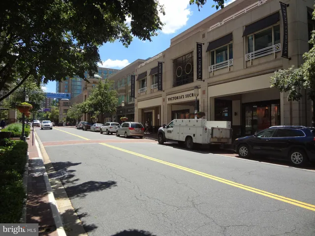 a view of street with parked cars