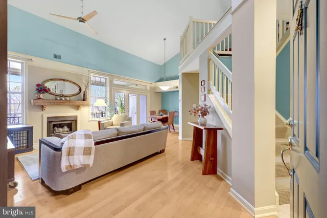 a living room with fireplace furniture and a flat screen tv