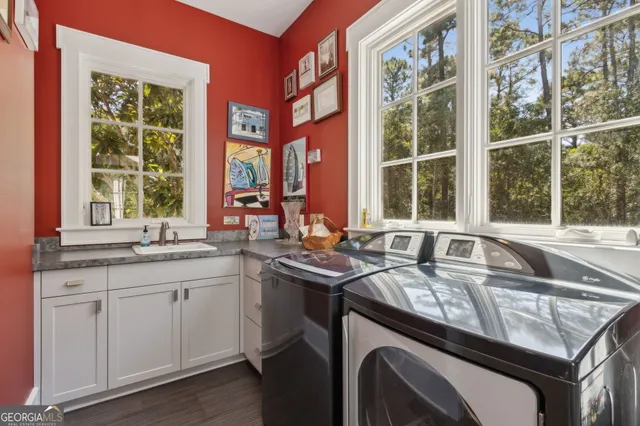 a bathroom with a granite countertop toilet sink and mirror