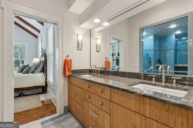 a front view of a house with basket ball court and outdoor seating