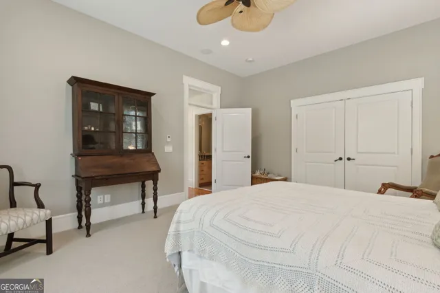 an aerial view of residential houses with outdoor space and trees