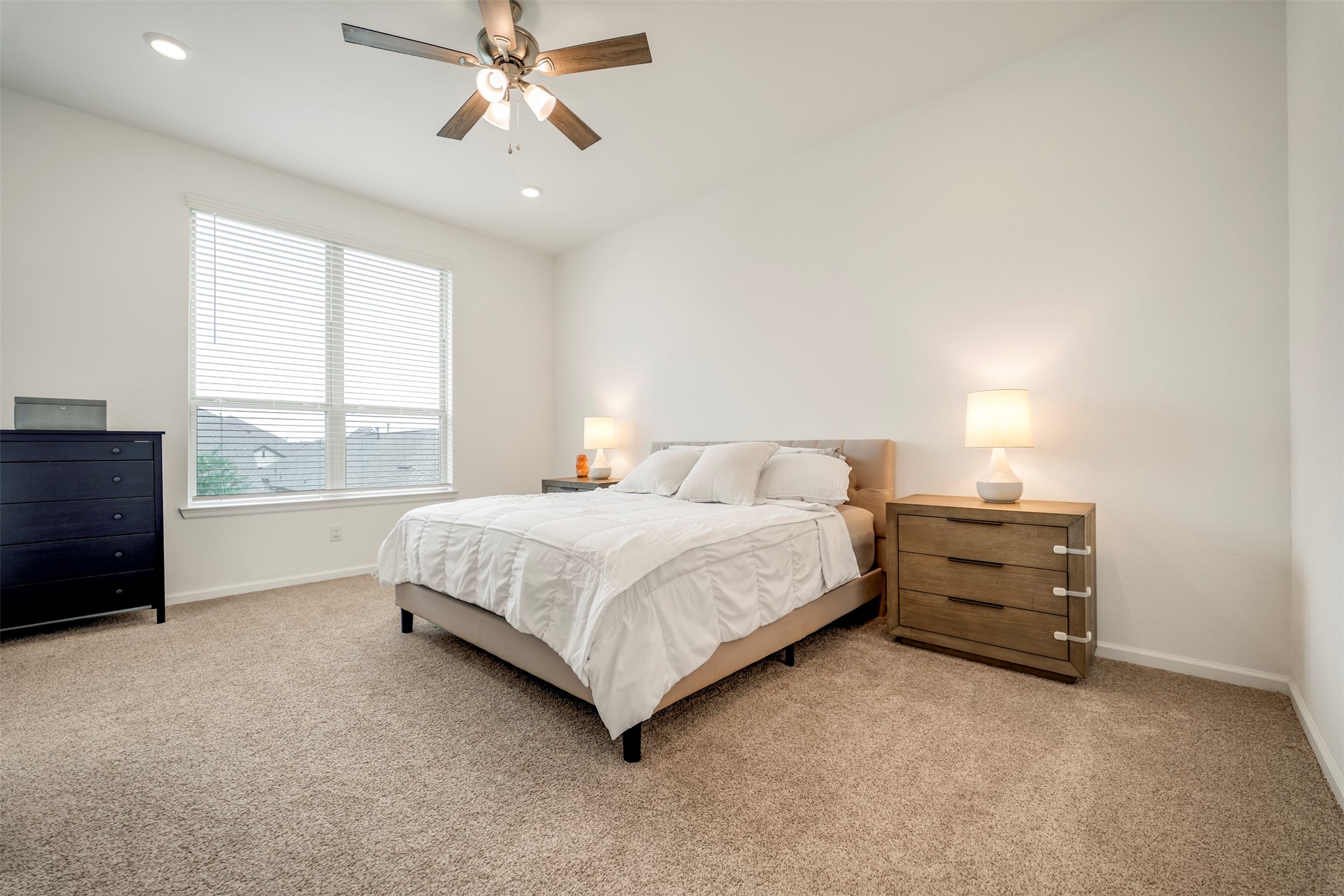 4127 Champlain Way Iowa Colony, TX 77583 - Photo 19 of 35 a bedroom with a bed and a window