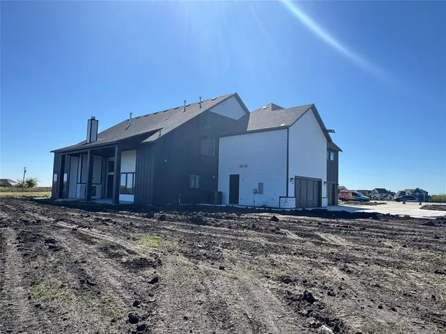 a front view of a house with a garage