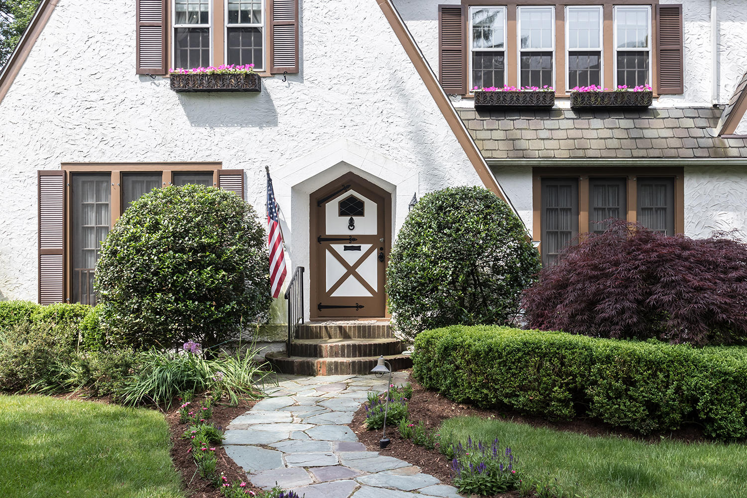 8 Abbey Road Darien, CT 06820 - Photo 2 of 39 a front view of a house with garden