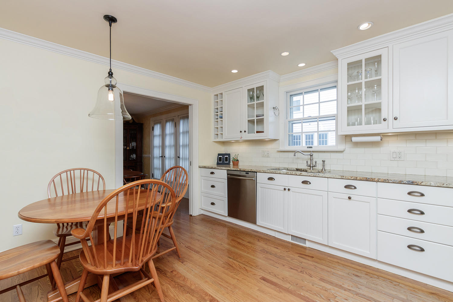 8 Abbey Road Darien, CT 06820 - Photo 11 of 39 a kitchen with stainless steel appliances granite countertop a kitchen island hardwood floor and a sink