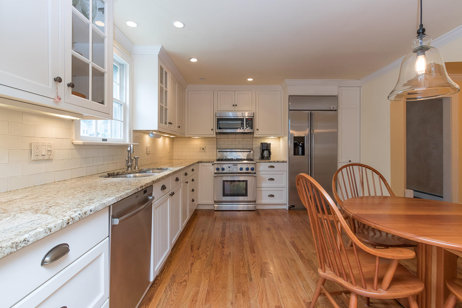 8 Abbey Road Darien, CT 06820 - Photo 12 of 39 a kitchen with granite countertop a sink a counter top space stainless steel appliances and cabinets