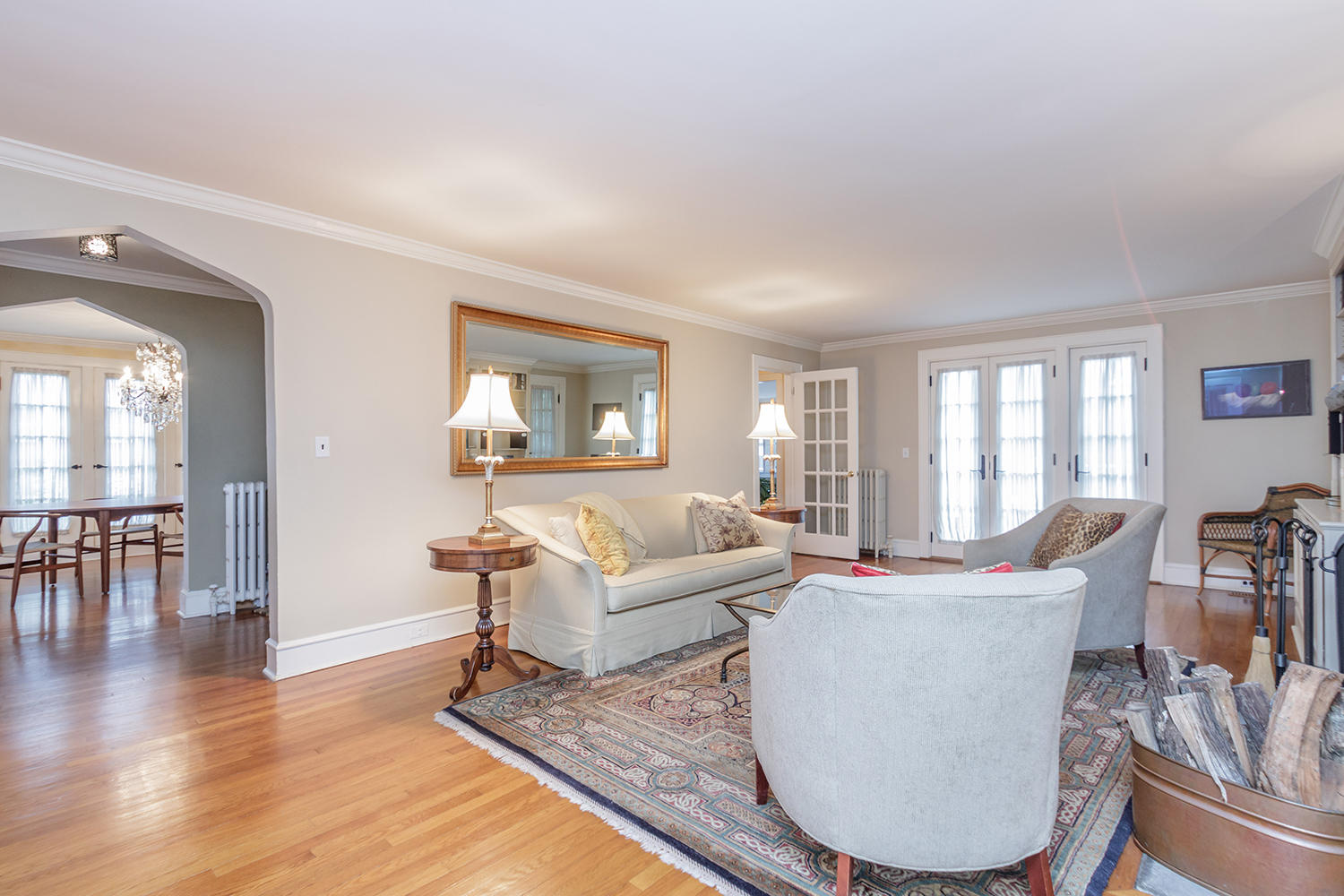 8 Abbey Road Darien, CT 06820 - Photo 3 of 39 a living room with furniture a wooden floor and a large window