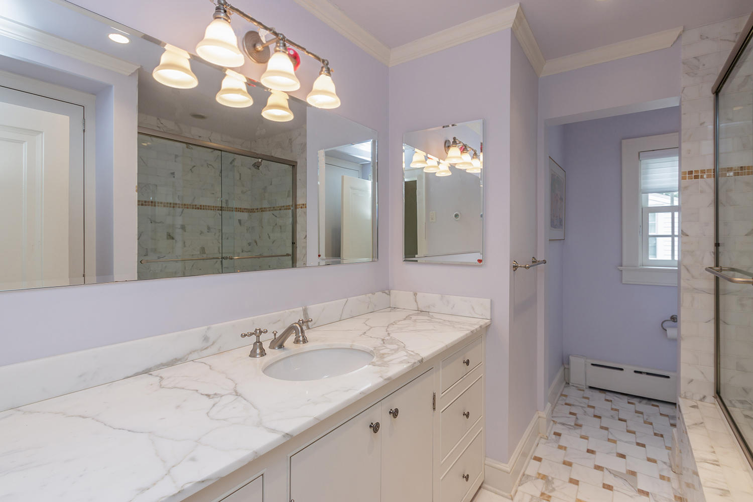 8 Abbey Road Darien, CT 06820 - Photo 30 of 39 a bathroom with a sink a light fixture and a mirror
