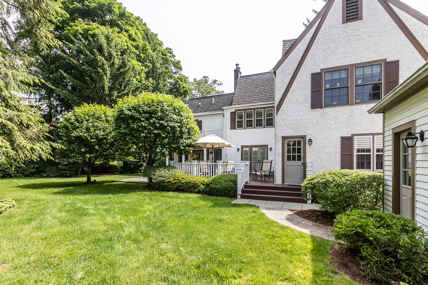 8 Abbey Road Darien, CT 06820 - Photo 35 of 39 a view of house in front of a big yard with large trees