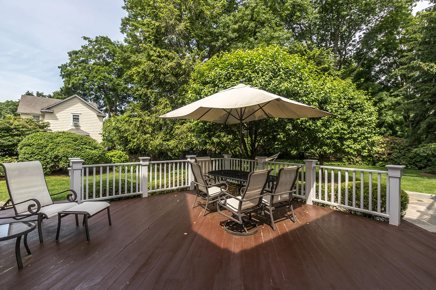 8 Abbey Road Darien, CT 06820 - Photo 36 of 39 a view of a patio with a table chairs and a barbeque