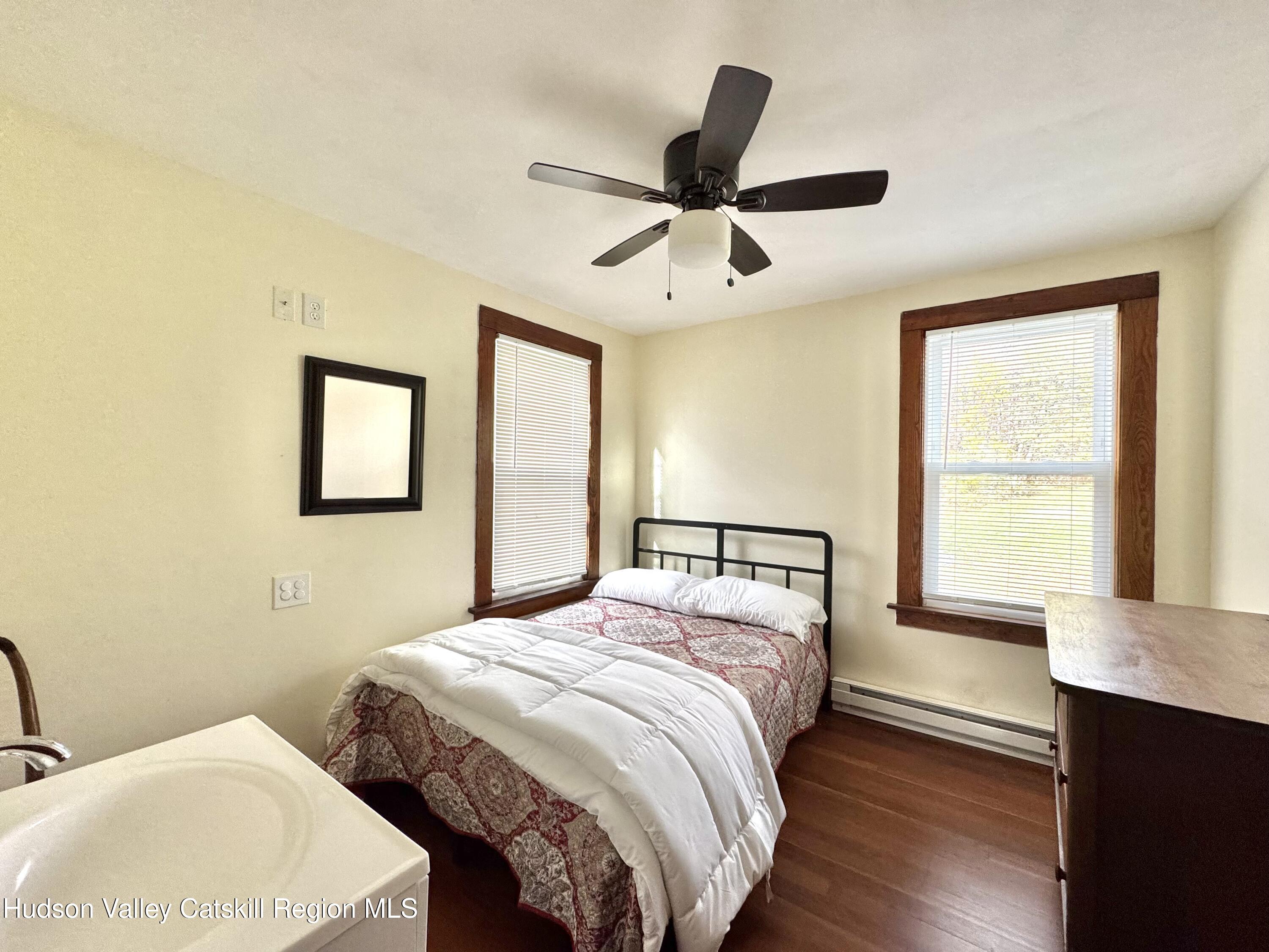 1114 Main Street Catskill, NY 12451 - Photo 17 of 40 a bedroom with a bed and a window