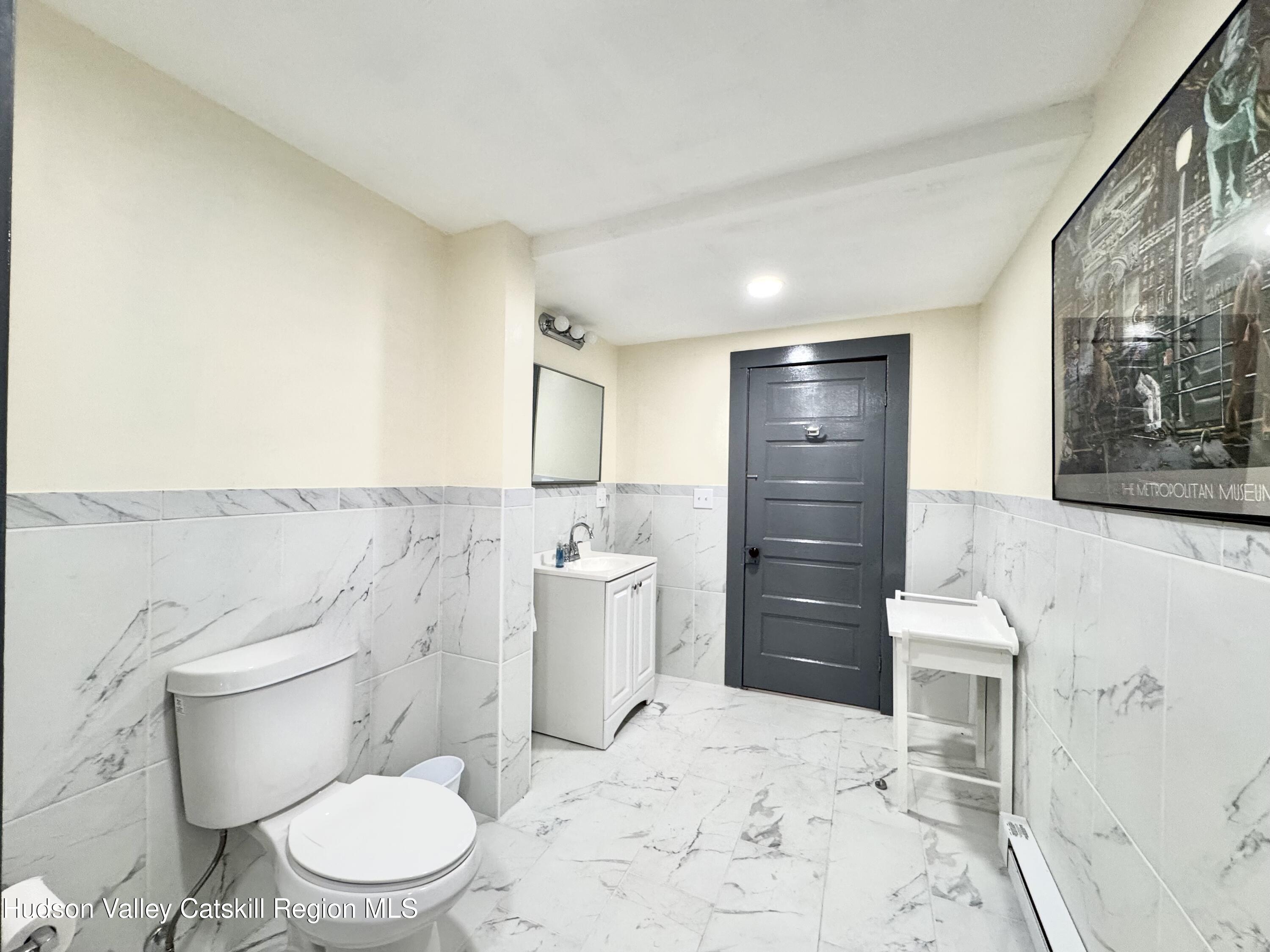 1114 Main Street Catskill, NY 12451 - Photo 20 of 40 a bathroom with a toilet sink and shower