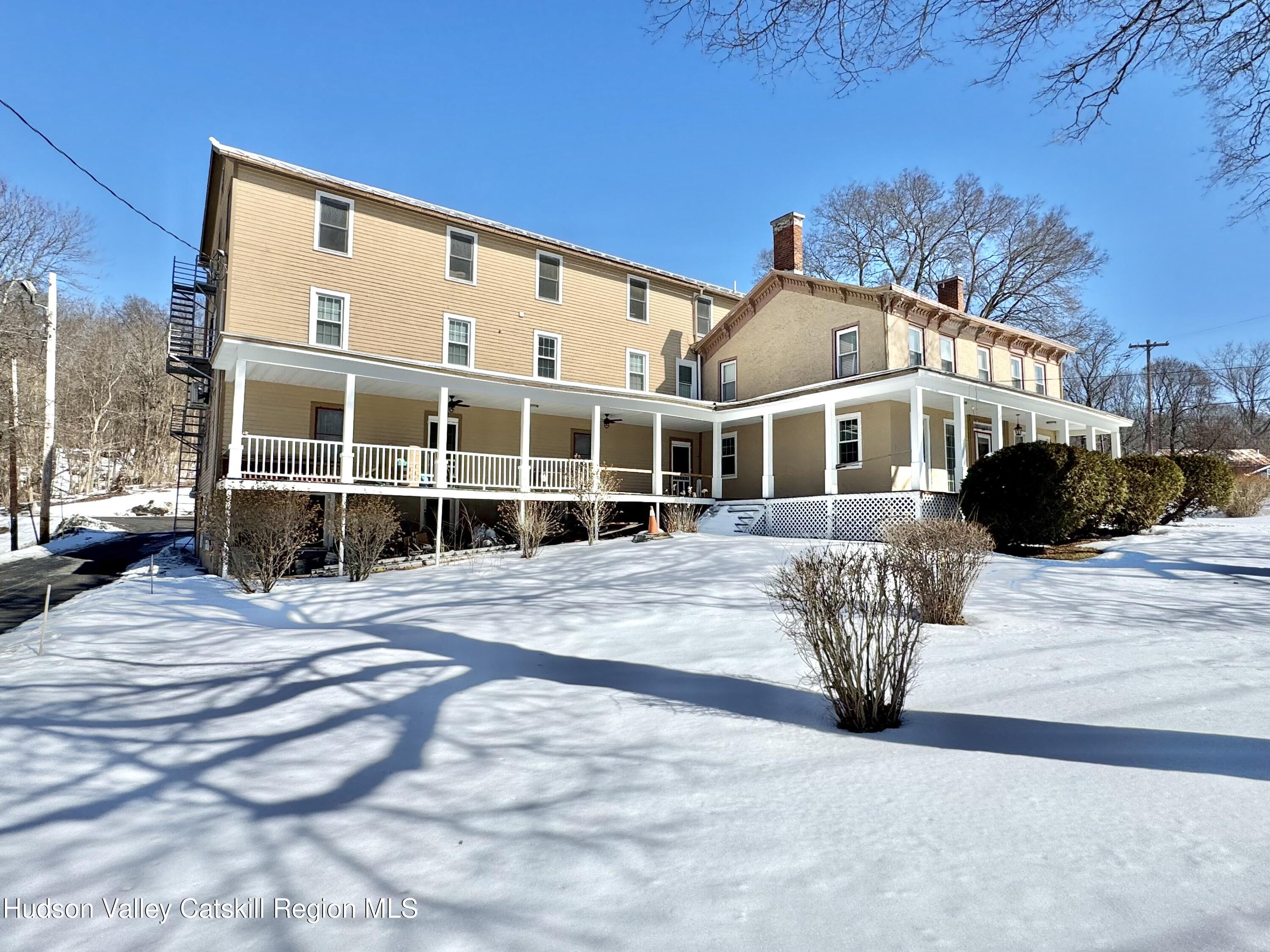 1114 Main Street Catskill, NY 12451 - Photo 2 of 40 a front view of a house with a yard