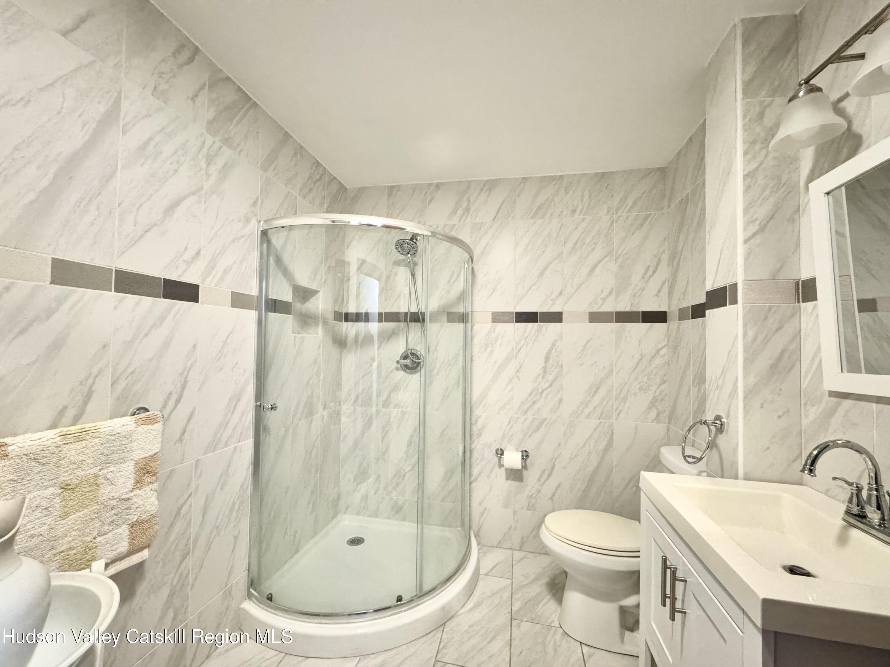 1114 Main Street Catskill, NY 12451 - Photo 21 of 40 a bathroom with a toilet and a sink
