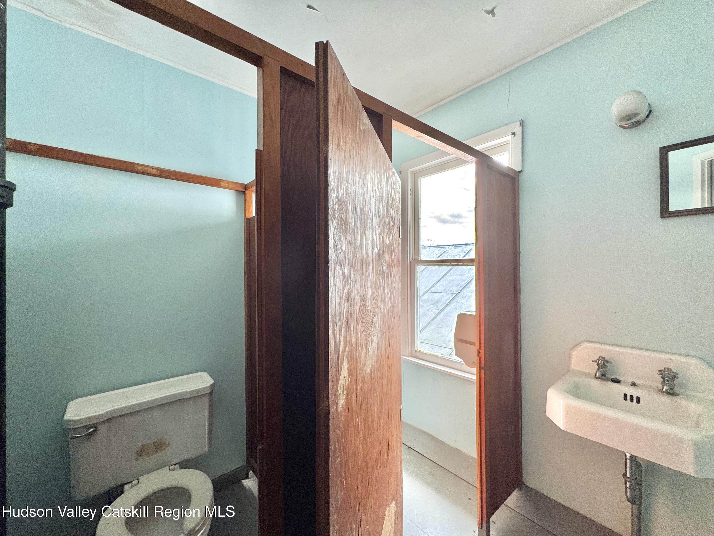 1114 Main Street Catskill, NY 12451 - Photo 26 of 40 a bathroom with a toilet sink and shower