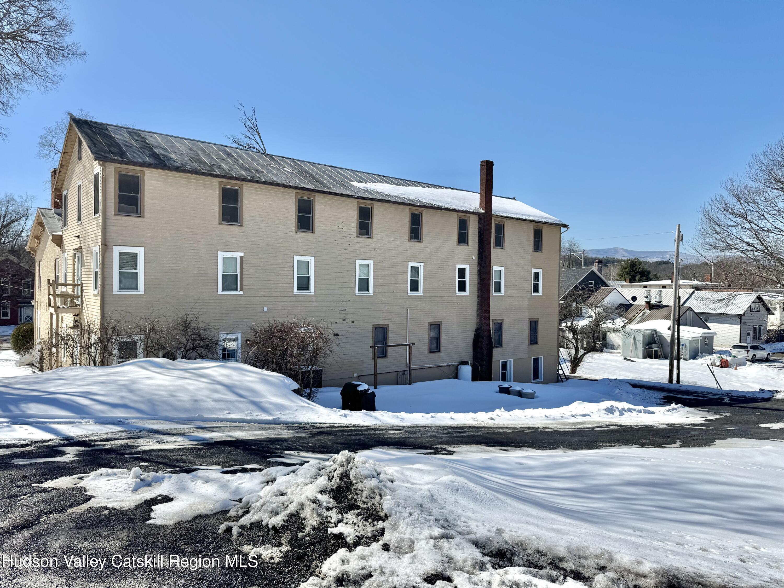1114 Main Street Catskill, NY 12451 - Photo 3 of 40 a front view of a house with garden