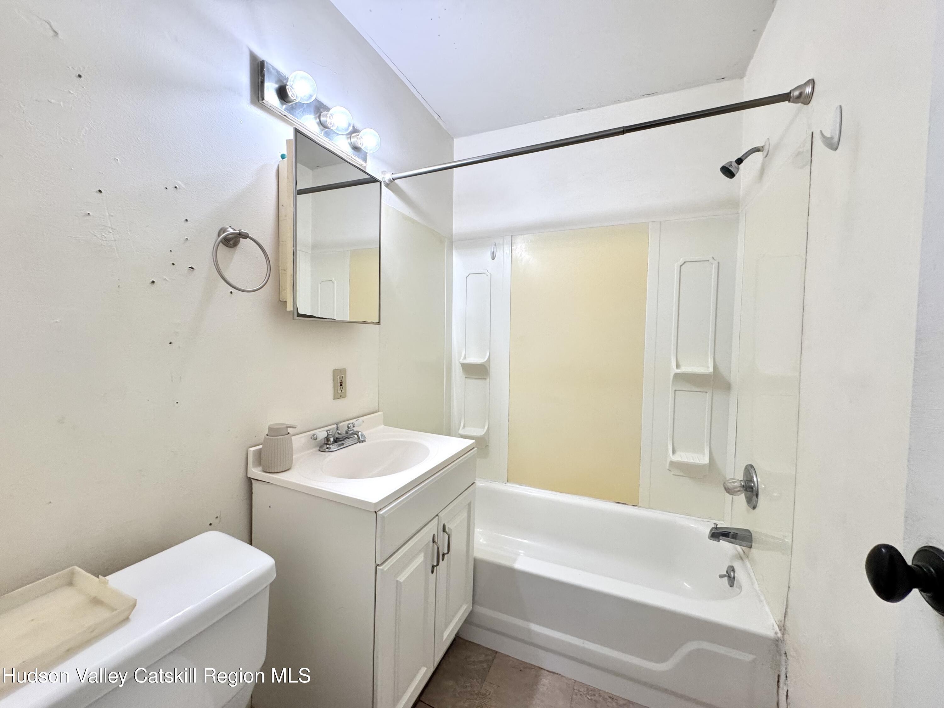 1114 Main Street Catskill, NY 12451 - Photo 31 of 40 a bathroom with a sink toilet and shower