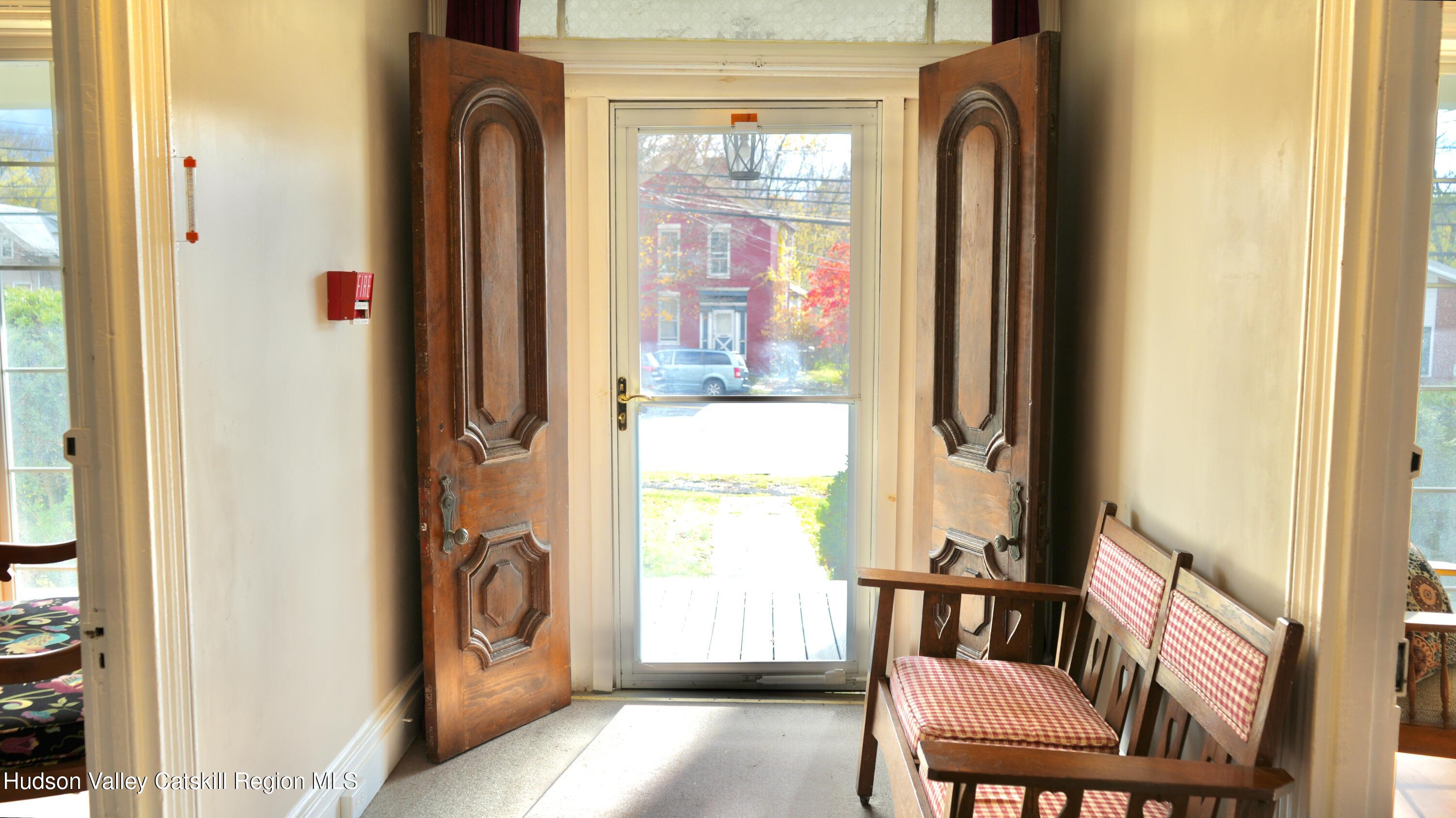 1114 Main Street Catskill, NY 12451 - Photo 8 of 40 a view of a balcony with furniture and a window