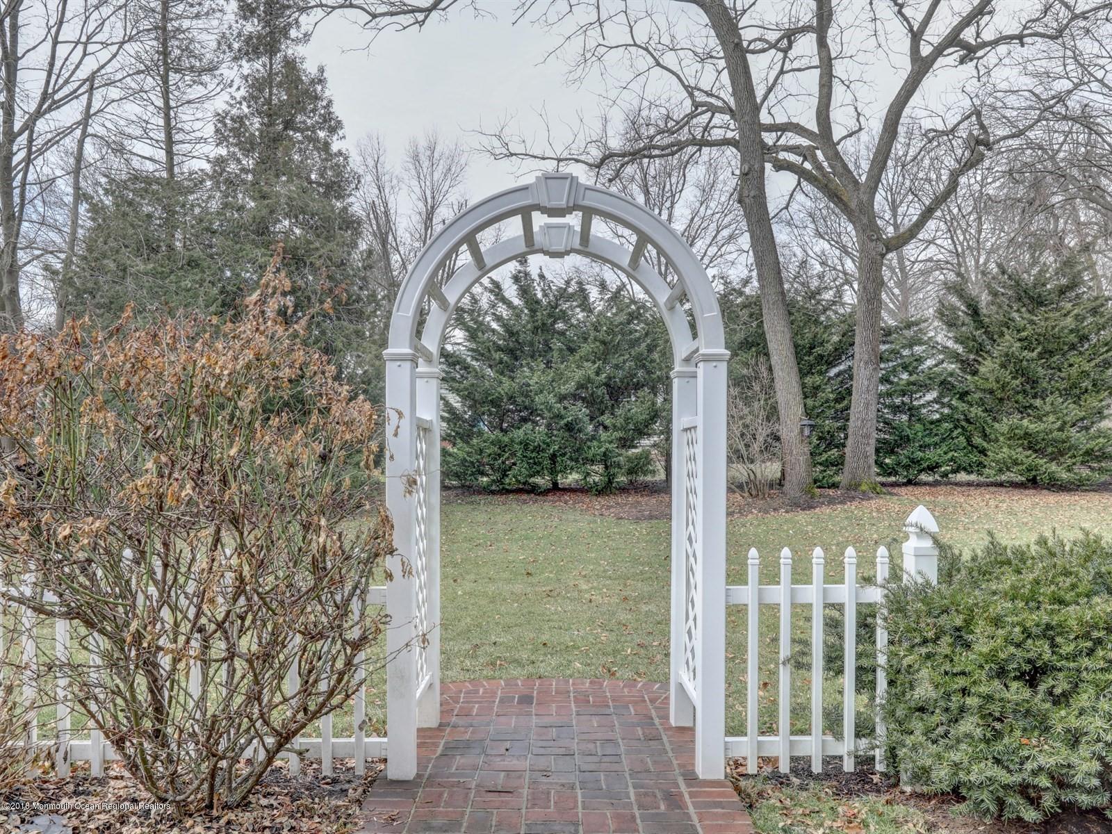 16 Rivers Edge Drive Little Silver, NJ 07739 - Photo 29 of 33 a view of a yard with plants and large trees