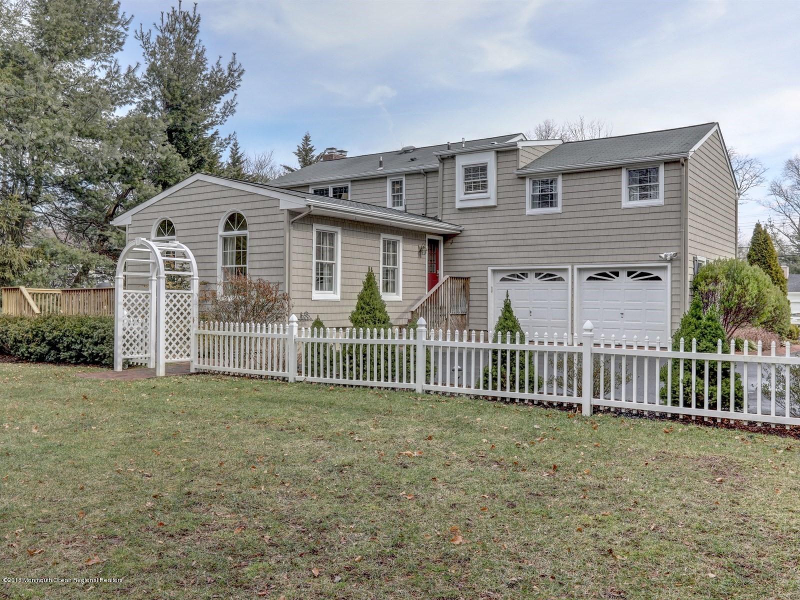 16 Rivers Edge Drive Little Silver, NJ 07739 - Photo 33 of 33 a view of a house with wooden fence next to a yard