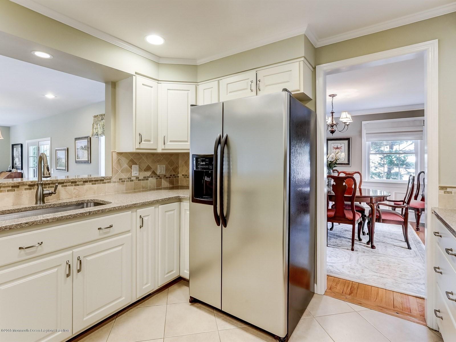 16 Rivers Edge Drive Little Silver, NJ 07739 - Photo 10 of 33 a kitchen with stainless steel appliances granite countertop a refrigerator and a sink