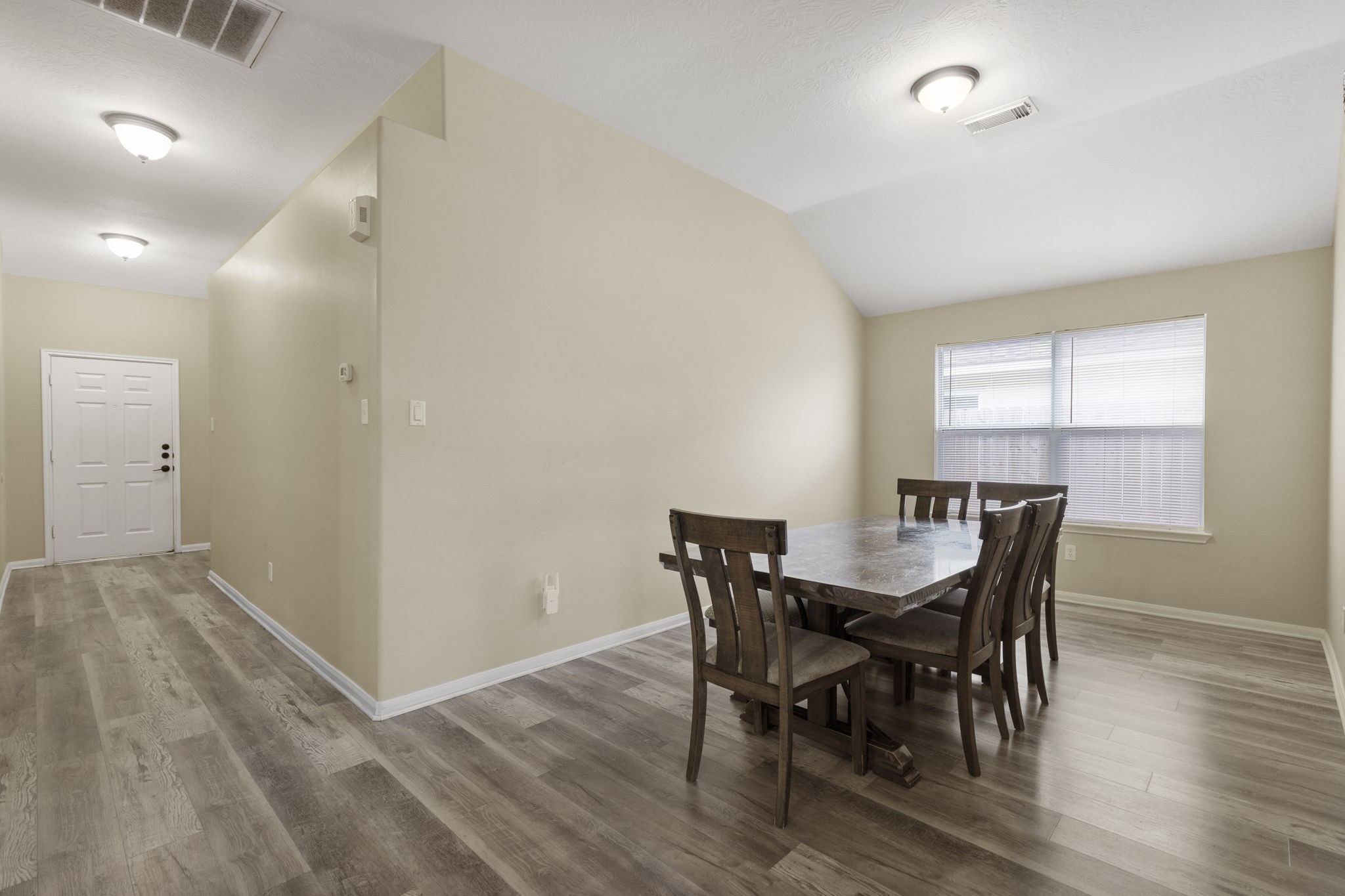 29106 Foxingham Circle Spring, TX 77386 - Photo 10 of 47 a view of a dining room with furniture and wooden floor