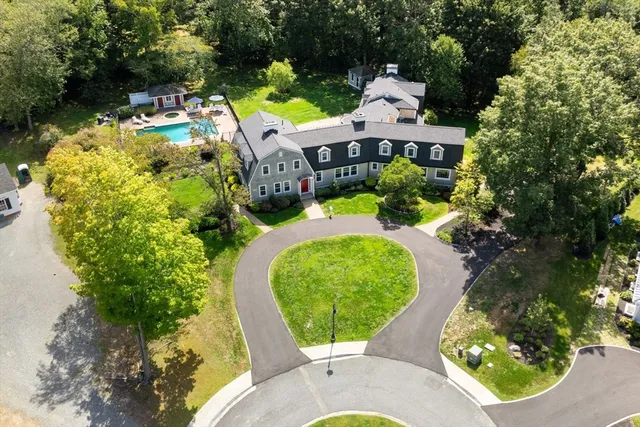 an aerial view of a house with outdoor space