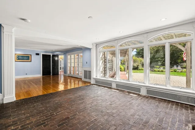 a view of an empty room with glass door