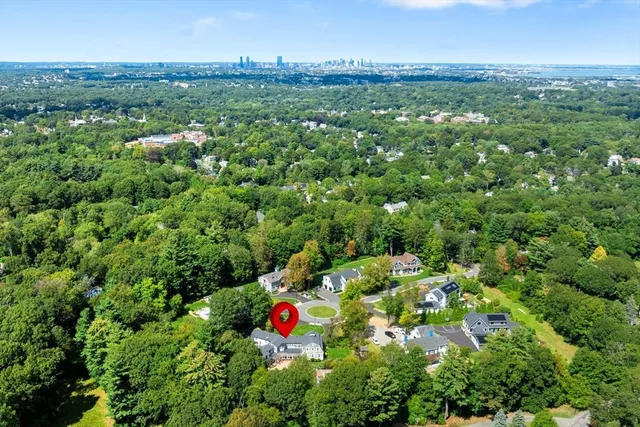 a view of a city and green field