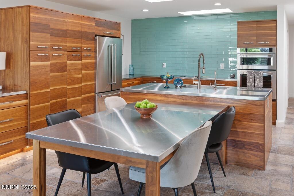 4811 Lakeridge Terrace West Reno, NV 89509 - Photo 16 of 43 a kitchen with a table and chairs in it