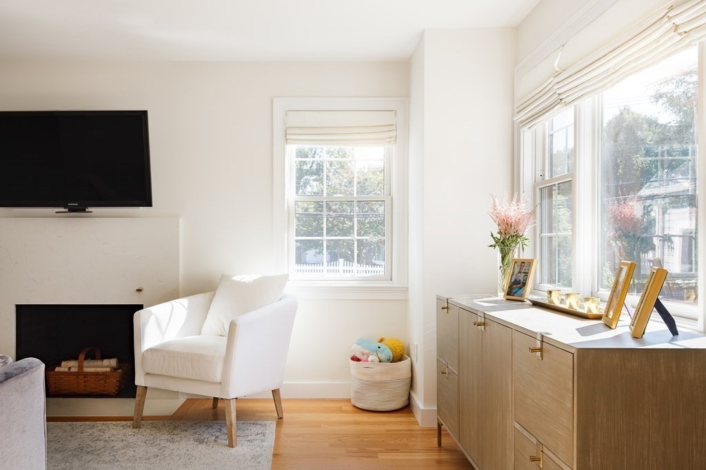 3 Garrison Road Wellesley, MA 02482 - Photo 12 of 36 a living room with furniture a flat screen tv and a window