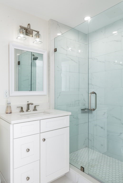3 Garrison Road Wellesley, MA 02482 - Photo 15 of 36 a bathroom with a sink a toilet and shower