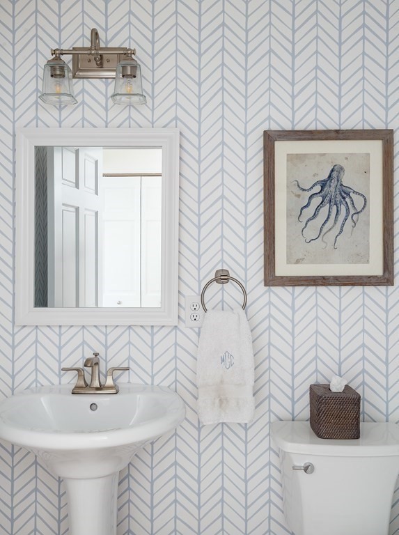 3 Garrison Road Wellesley, MA 02482 - Photo 17 of 36 a bathroom with a sink and a mirror