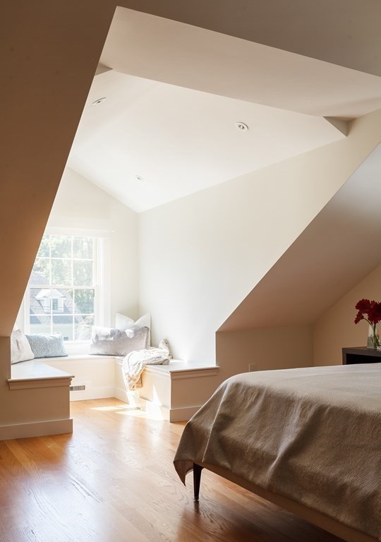3 Garrison Road Wellesley, MA 02482 - Photo 19 of 36 a living room with a large window and furniture