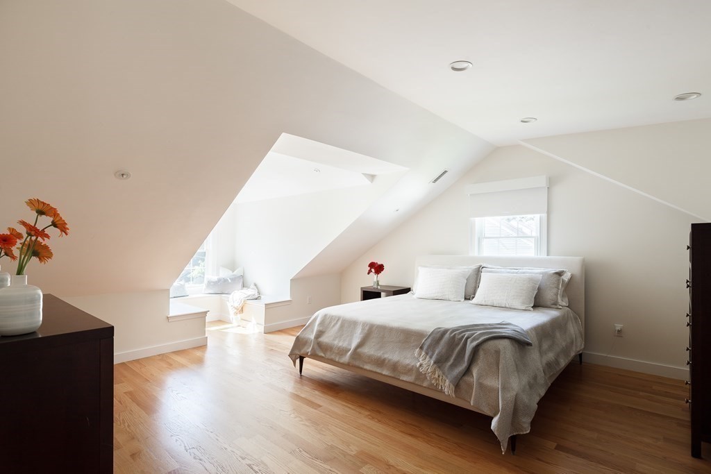 3 Garrison Road Wellesley, MA 02482 - Photo 20 of 36 a bedroom with a bed and wooden floor