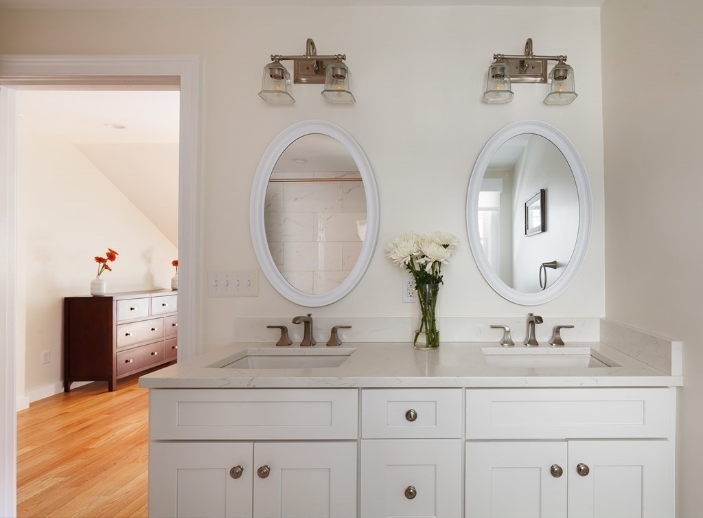 3 Garrison Road Wellesley, MA 02482 - Photo 22 of 36 a bathroom with double vanity sink and a mirror