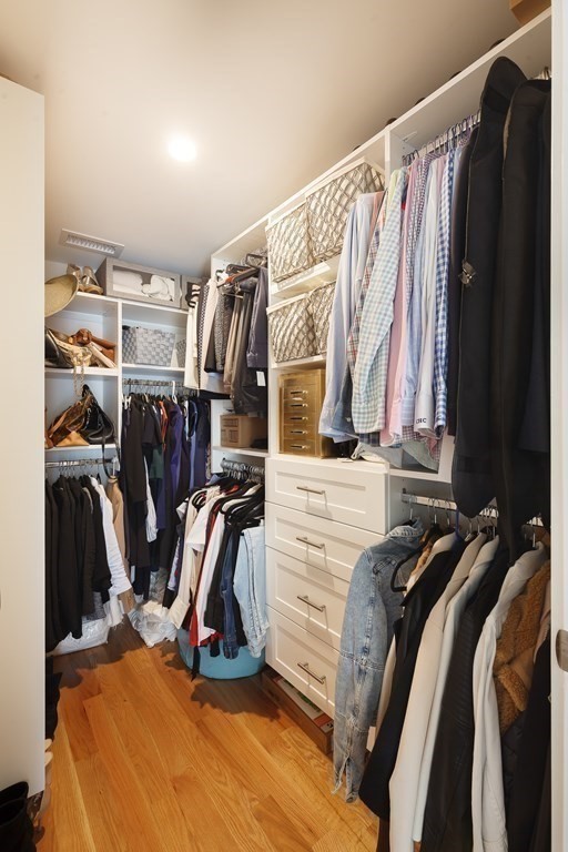 3 Garrison Road Wellesley, MA 02482 - Photo 23 of 36 a view of walk in closet with clothes and shoes