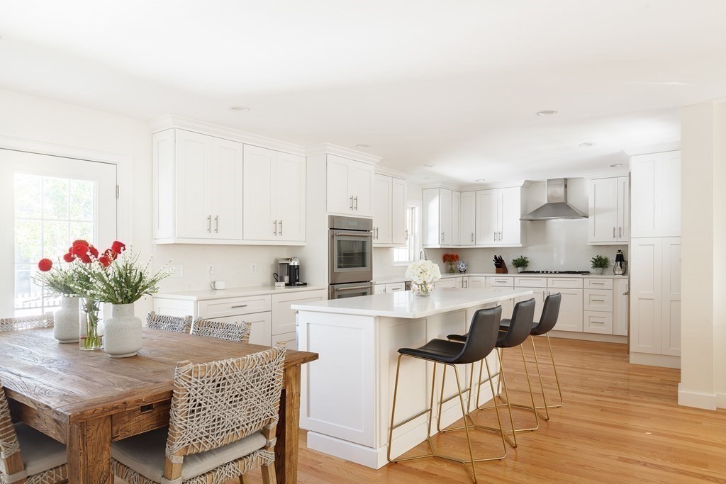 3 Garrison Road Wellesley, MA 02482 - Photo 3 of 36 a kitchen with granite countertop white cabinets and white appliances