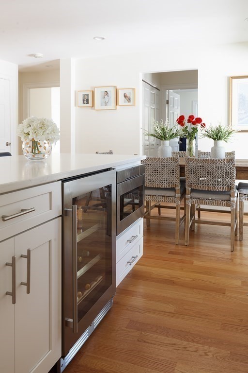 3 Garrison Road Wellesley, MA 02482 - Photo 6 of 36 a kitchen with stainless steel appliances wooden floor and chair