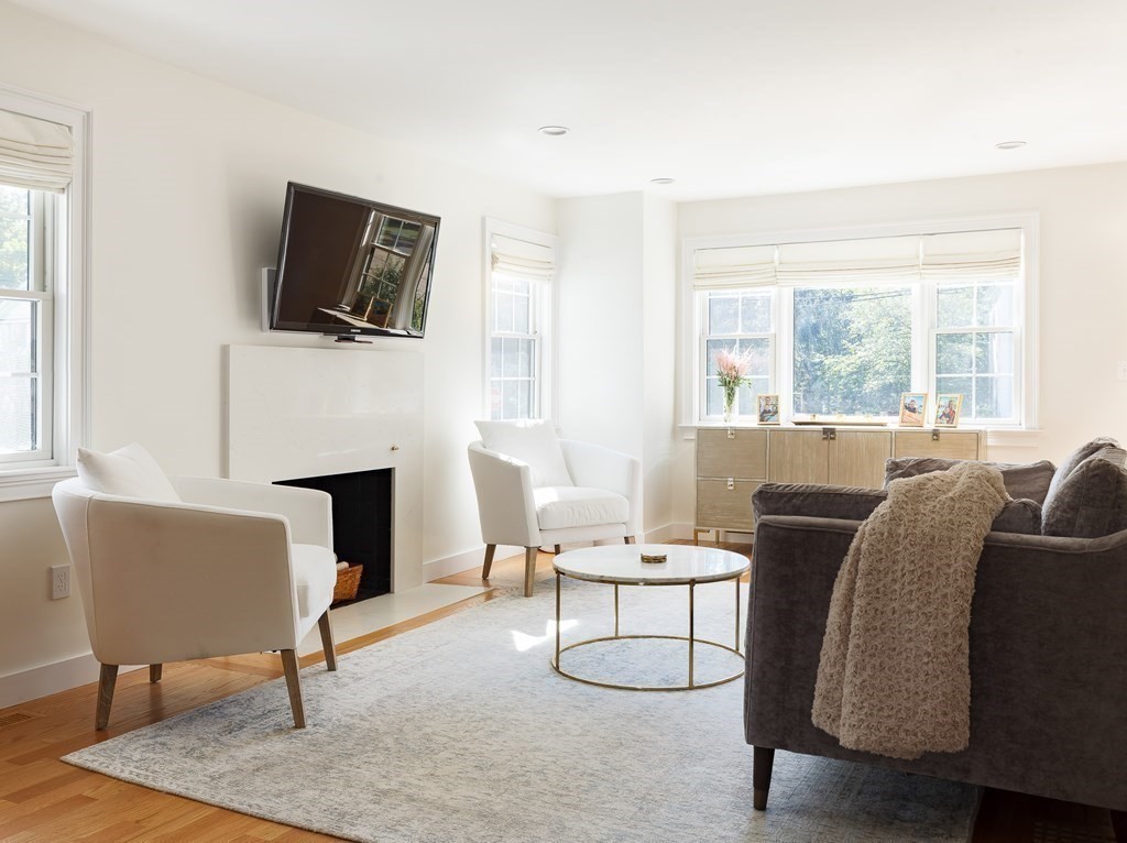 3 Garrison Road Wellesley, MA 02482 - Photo 10 of 36 a living room with furniture a flat screen tv and a fireplace